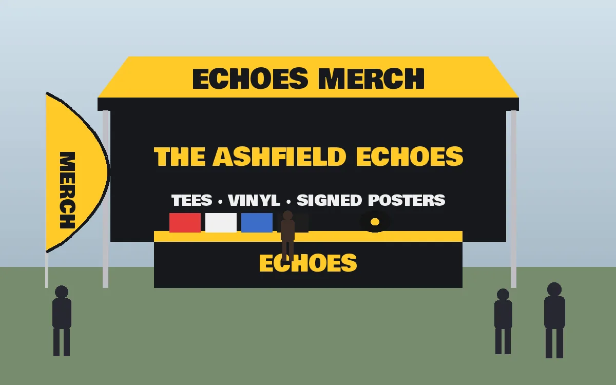 Band merch desk under a printed marquee with a table throw